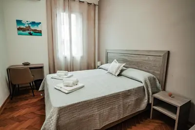 Letto o letti in una camera di Angelica Home
