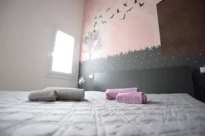 Letto o letti in una camera di Altana Deluxe Apart