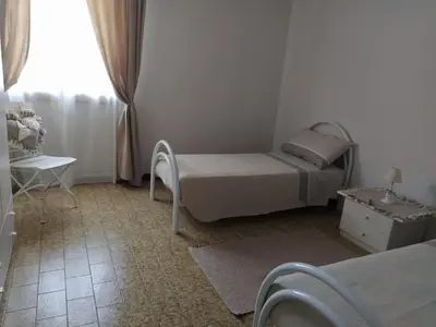 Letto o letti in una camera di Casa via degli Ulivi 13