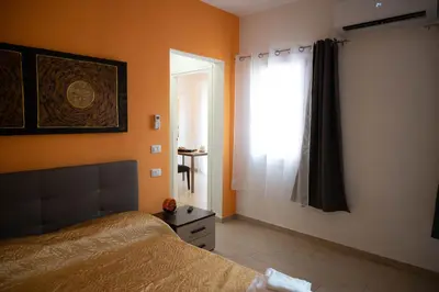 Letto o letti in una camera di DIMORA ROSSA