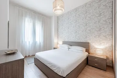 Letto o letti in una camera di Centro Storico - Stazione a 500m Strategico Elegant Loft
