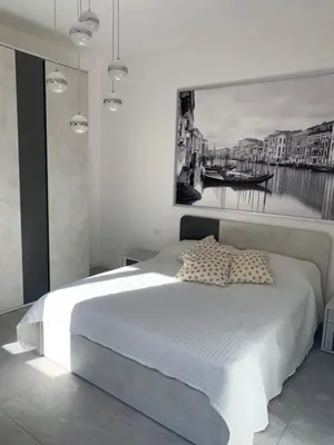 Letto o letti in una camera di SUITE CA’ DELLA TANA