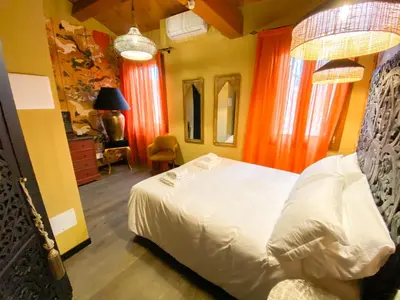 Letto o letti in una camera di Rigoletto Charm
