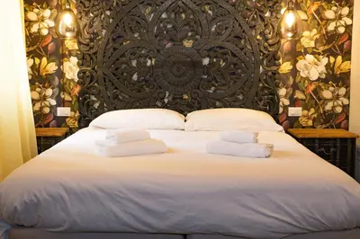 Letto o letti in una camera di Rigoletto Charm