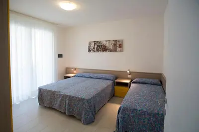 Letto o letti in una camera di Jesolo Green Village