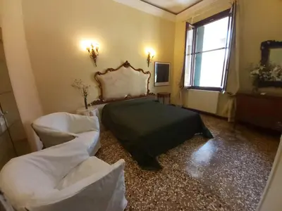 Letto o letti in una camera di A PRIVATE TERRACE IN THE HEART OF VENICE