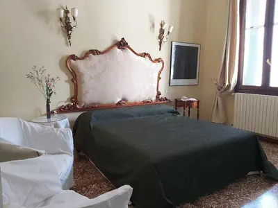 Letto o letti in una camera di A PRIVATE TERRACE IN THE HEART OF VENICE