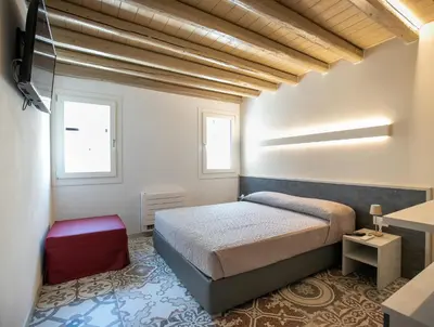 Letto o letti in una camera di Casa Boscolo Family - Luxury House