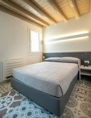 Letto o letti in una camera di Casa Boscolo Family - Luxury House