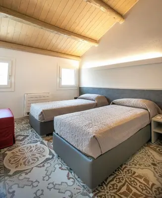 Letto o letti in una camera di Casa Boscolo Family - Luxury House