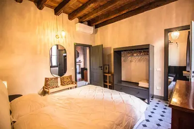 Letto o letti in una camera di Cà Fenice Design