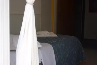 Letto o letti in una camera di Hotel Neps