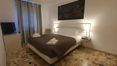 Letto o letti in una camera di Casa del Pozzo