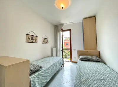 Letto o letti in una camera di Residence Ca D'Oro con piscina Cavallino - Carraro Immobilare - Family Apartments