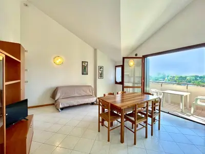 Area soggiorno di Residence Ca D'Oro con piscina Cavallino - Carraro Immobilare - Family Apartments