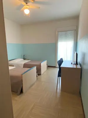 Letto o letti in una camera di Casa Vacanze Paolo VI