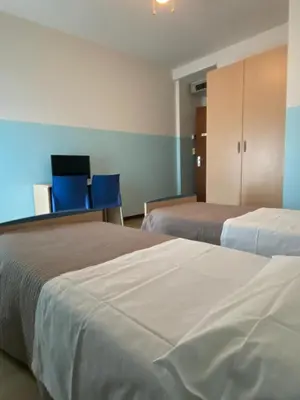 Letto o letti in una camera di Casa Vacanze Paolo VI