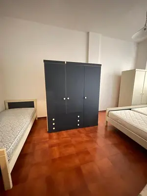 Letto o letti in una camera di CONDOMINIO UNION -Walterigato Apartments- SOLO PER FAMIGLIE-