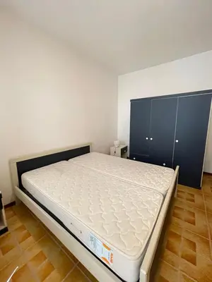 Letto o letti in una camera di CONDOMINIO UNION -Walterigato Apartments- SOLO PER FAMIGLIE-