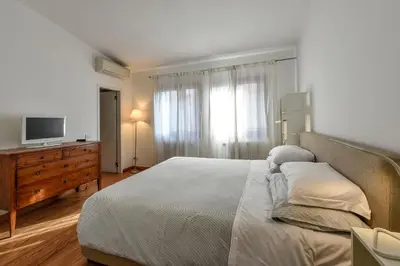 Letto o letti in una camera di Le case di Rachele - Ca' Lorenzo e Ca' Raquel
