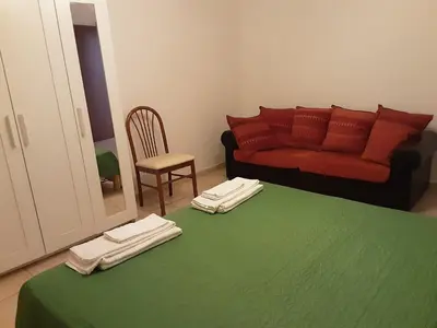 Letto o letti in una camera di Locazione Menini - Camere zona stazione
