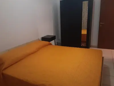 Letto o letti in una camera di Locazione Menini - Camere zona stazione
