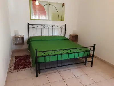 Letto o letti in una camera di Locazione Menini - Camere zona stazione