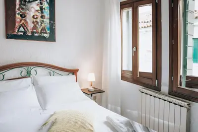Letto o letti in una camera di Bricola Biennale Apartments