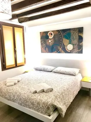 Letto o letti in una camera di Cà dei Santi- BIENNALE
