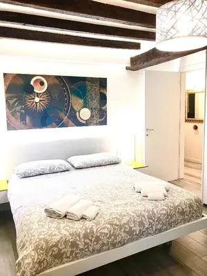 Letto o letti in una camera di Cà dei Santi- BIENNALE