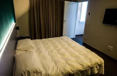 Letto o letti in una camera di Venice Terminal Apartments & Suites