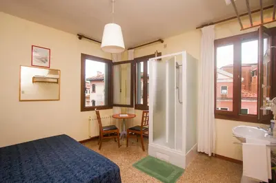 Letto o letti in una camera di Hotel dalla Mora