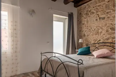 Letto o letti in una camera di Appartamenti Monte Selce