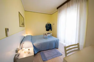 Letto o letti in una camera di Le Petit Hotel