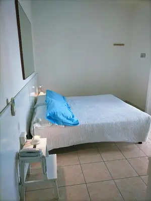 Letto o letti in una camera di Le Petit Hotel