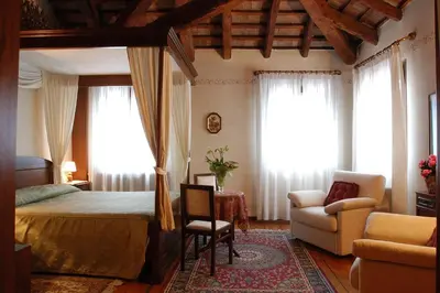 Letto o letti in una camera di Locanda Stella D'oro