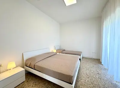 Letto o letti in una camera di Villa Fronte Mare - Carraro Immobiliare - Family Apartments
