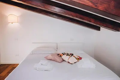 Letto o letti in una camera di Guggenheim Luxury Suites By Bricola Apartments