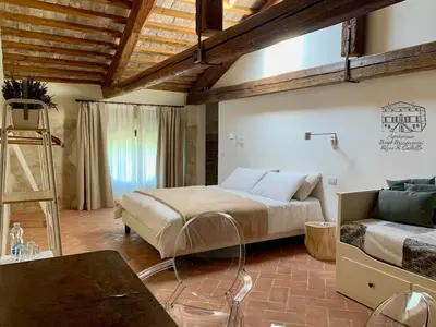 Letto o letti in una camera di Agriturismo Borgo Buzzaccarini Rocca di Castello