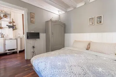Letto o letti in una camera di Ca Falier Piccolo - little sweet studio in 10-12 minutes from bus&train station