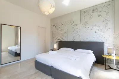 Letto o letti in una camera di Infinite House Guglie