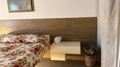 Letto o letti in una camera di Corte Coppo Deluxe Apartment