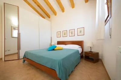 Letto o letti in una camera di Dimora Marina - Isola di Pellestrina Ve