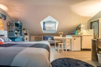 Letto o letti in una camera di enJoy Home - Monolocale S Sofia sui tetti di Padova