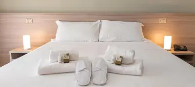 Letto o letti in una camera di Hotel Ammare