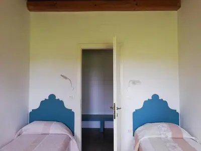 Letto o letti in una camera di Corte Monticello