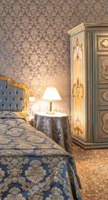 Letto o letti in una camera di palazzo suite ducale