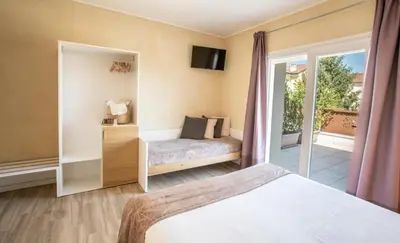 Letto o letti in una camera di Locanda GIOVI CA' DI PONTE