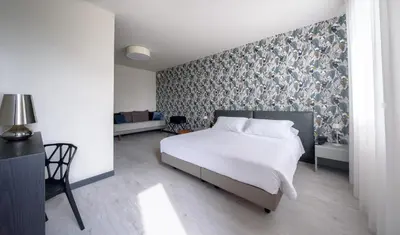 Letto o letti in una camera di Hotel Zenit