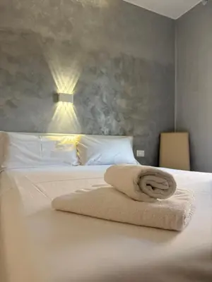 Letto o letti in una camera di Venice Sanella Rooms